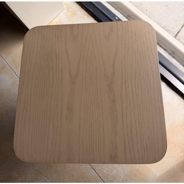 Bring understated elegance to your space with this contemporary wood end table, featuring a flared pedestal base and a...