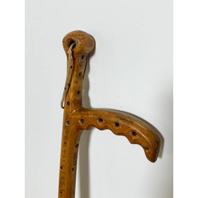 A pair of folk art hand carved canes or walking sticks and a small stick by Joseph Deveau (1901-1999). Deveau lived most...