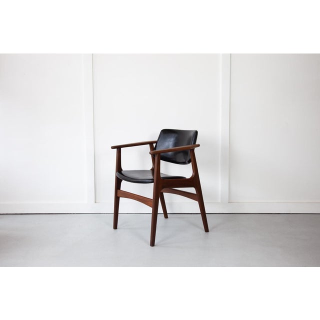 The 'Lene' armchair, designed by Arne Vodder, with a solid teak frame and comfortable padded seat and backrest which are...
