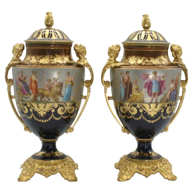 19th century gilt bronze mounted hand painted and crafted porcelain pair decorative covered urn / vase. Each urn features...