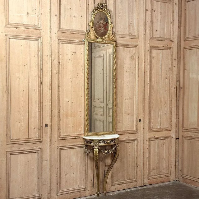 Antique French Louis XVI Gilded Trumeau Mirror is ideal for narrow wall spaces, entryways or halls. These are especially...