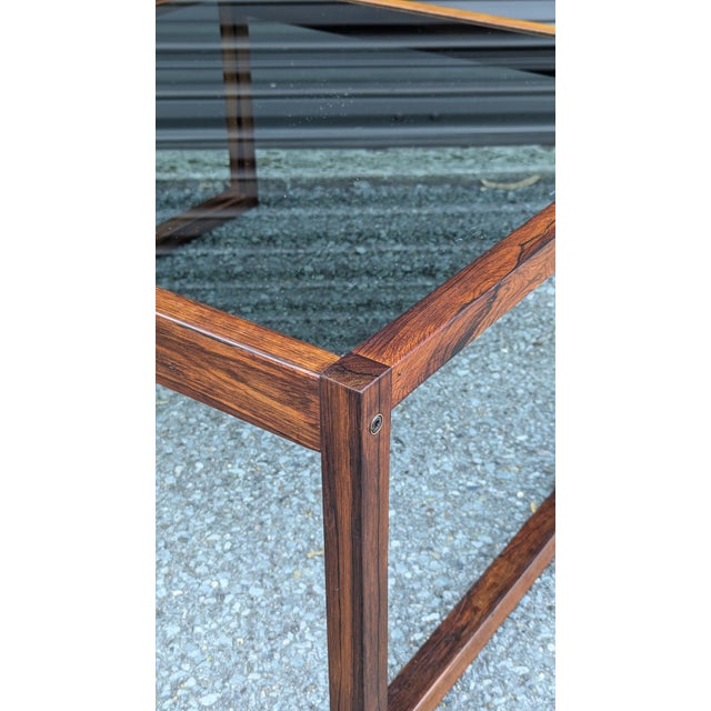 Professionally refinished, low-slung, and paired with original smoked glass that keeps it from reading as purely period....