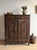 A remarkable late 19th-century French oak cabinet distinguished by its taller, more architectural proportions and finely...