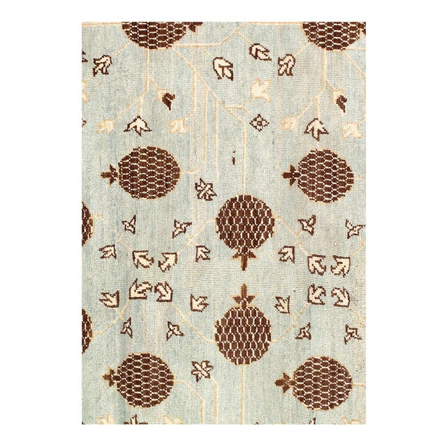 Simple and yet elegant, the Khotan Hand-Knotted Wool Light Blue/ Beige Area Rug is a stylish choice for any room. Hand-...