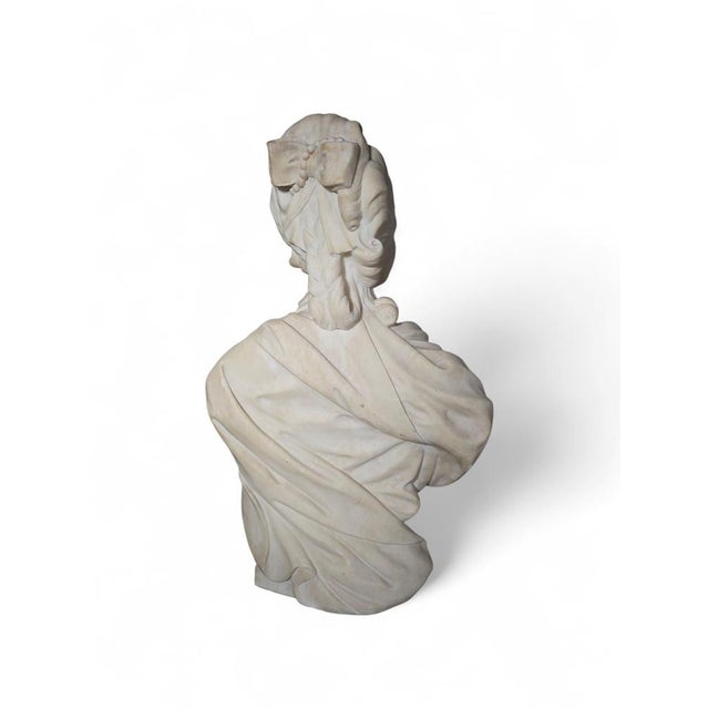 Refined 19th-century marble bust depicting Marie Antoinette, exquisitely sculpted in white Carrara marble. The work is of...
