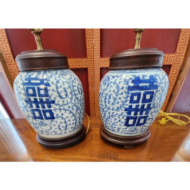 Enhance your space with these beautiful, almost a pair of vintage Chinese blue and white porcelain ginger jar table lamps....