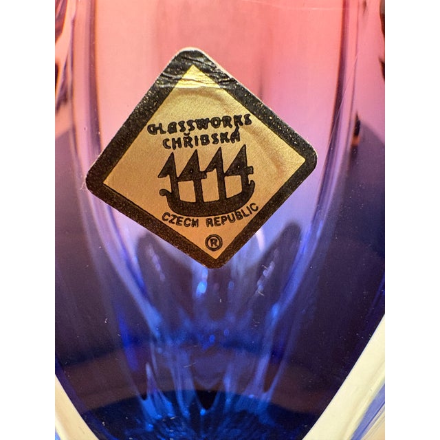 The permutation of the blue and pink are so vivid. It is indeed heavy art glass but there is a style represented by the...