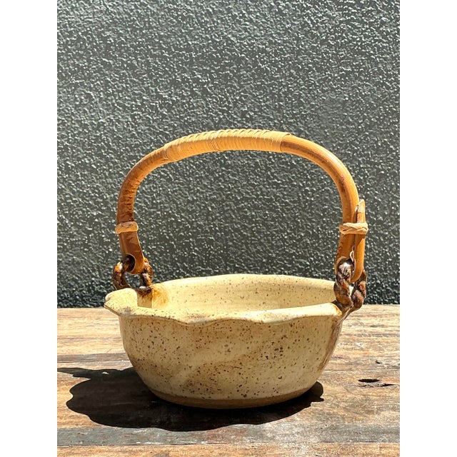 This charming piece of studio pottery, dated 1993 and signed "Kathy," beautifully blends rustic textures with an organic...