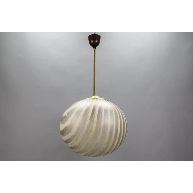 Mid-century modern striped glass globe pendant by peill & putzler, germany, 1970s. handblown shade with frosted and darker...