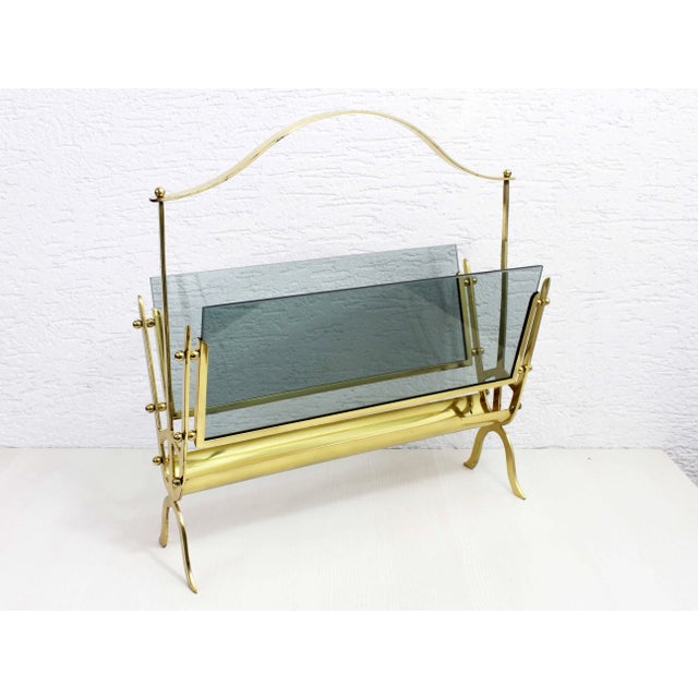 French magazine rack from Maison Jansen from the 1950s This all-brass and glass piece is simply superb. Well made and with...