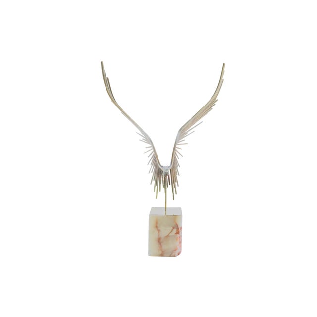 Curtis Jeré brass and marble eagle sculpture, 1977. A brutalist style brass rod composition in the form of a bird, with...