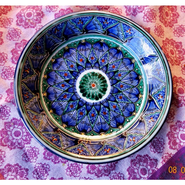 Handpainted MidEastern plate, intricate design, with deep blues, yellow, persimmon, greens. Beautiful signature, not able...