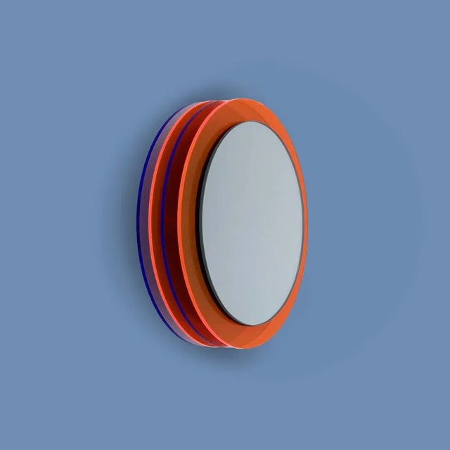 The mirror object floats in front of the wall and creates a fascinating sculpture full of positive energy through color,...