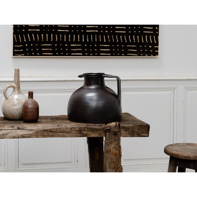 A beautiful, large terracotta baker's jug, made by Jean and Geneviève Dubost in the 1970s. This large model is appealing...