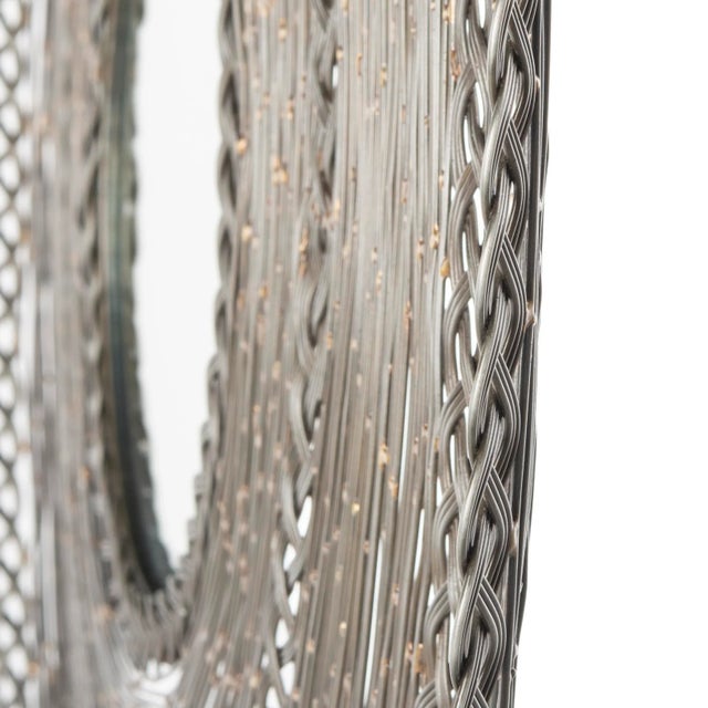 Designed with layers of rich textures and intricate patterns, this contemporary metal mirror is a modern marvel. it's...