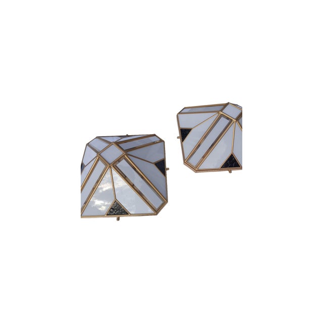 Elegant geometric-style wall sconces/ceiling lights dating back to 1970s Italy. The square-based structure (36 x 36 cm) is...