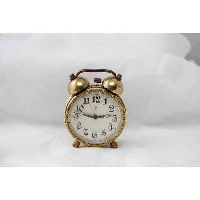 Gold alarm desk clock Mechanical table clock Brass, plastic cover. France, 1970s. Working condition. Dimensions: Height...