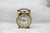 Gold alarm desk clock Mechanical table clock Brass, plastic cover. France, 1970s. Working condition. Dimensions: Height...