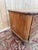 A louis xv period commode, crafted from solid cherry wood, featuring three wide drawers with shaped fronts. the fronts are...