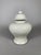 Early Qing Dynasty porcelain vase, 18th century. This monochrome cream-white porcelain vase is incised under the glaze...