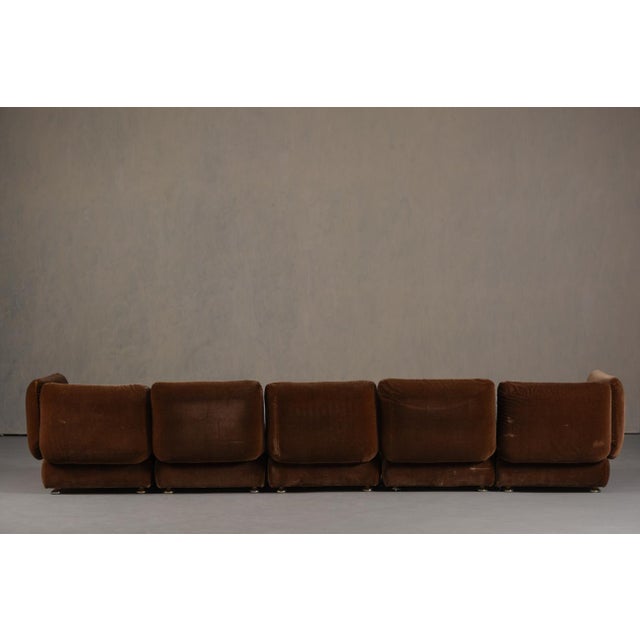 A vintage Italian modular sofa from the 1960's. The producer and designer are unknown. Made from fabric and foam, this...