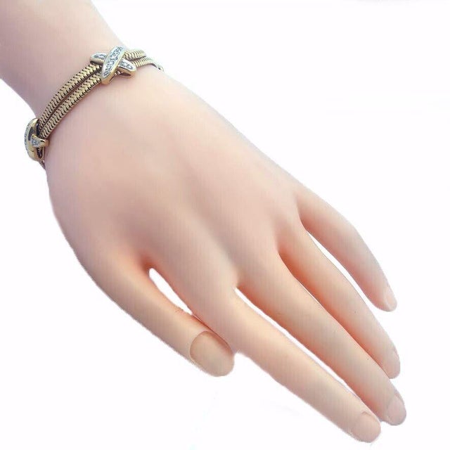 This lovely casual everyday bracelet is crafted from 14k yellow gold with white gold accent featuring a double snake chain...