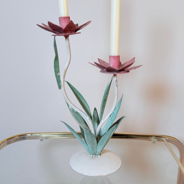 Toleware at its most poetic. This vintage two-arm tole candelabra features hand-painted lotus flowers and naturalistic...