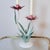 Toleware at its most poetic. This vintage two-arm tole candelabra features hand-painted lotus flowers and naturalistic...