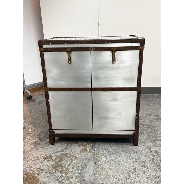 Design Plus Gallery presents the Richard's Trunk Aluminum Steamer Trunk Bar Cabinet by Timothy Oulton from Restoration...