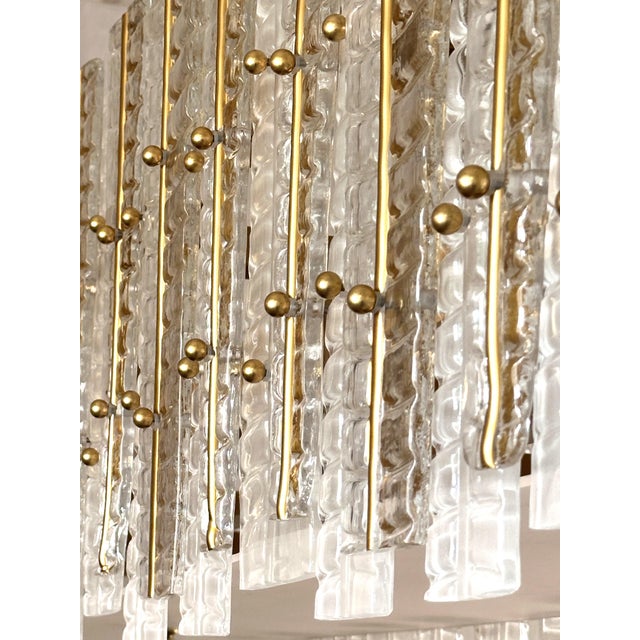 Contemporary gold chandelier in Murano Glass full of leaves that give a touch of “tropical” design. Extremally elegant and...