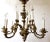 Circa 1900 French cast bronze 12-light chandelier, Louis XIV style. Baroque influence C-scroll based form, the whole...