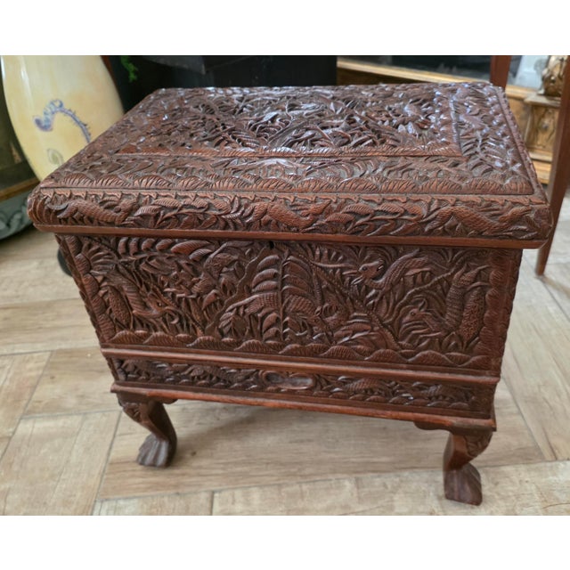 Beautiful early 20th Century ornately carved chest with a drawer accross the bottom and a lift top chamber with a...