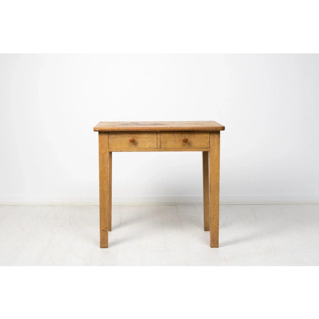 Primitive Swedish folk art table made during the early 1800s. The table has a simple construction with a solid frame,...