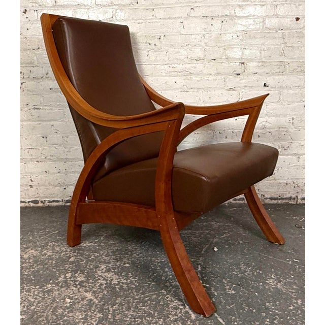 This wonderful hand made chair and ottoman comes from the Thos. Moser factory in Maine, and comes signed by the specific...