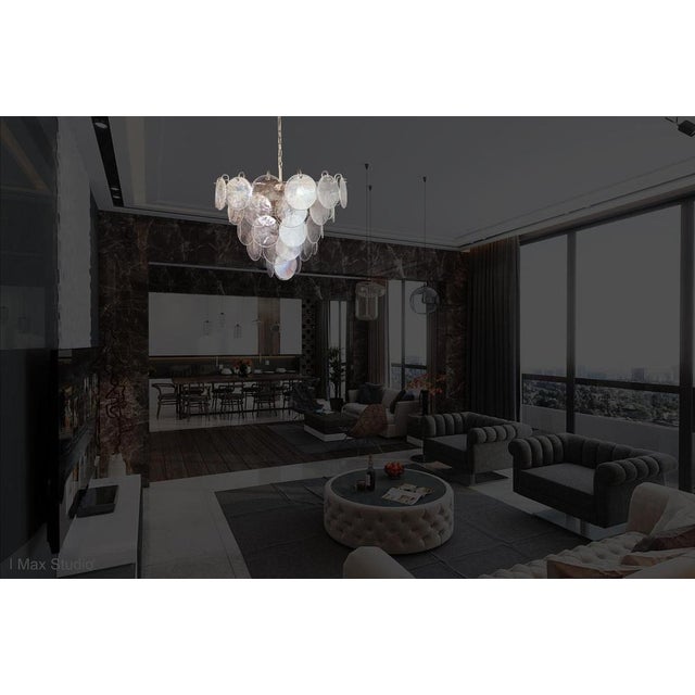 Italian Murano chandelier. The chandelier has 57 Murano iridescent glass disks. The glasses are now unavailable, they have...