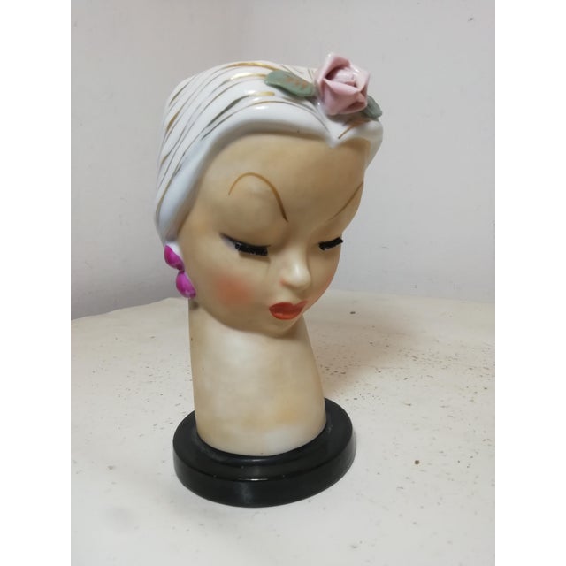 Lady Head or Ucagco girl's head, made in Japan. It was used by florists to create flower bud arrangements that were then...