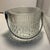 The Mid-Century Glass and Chrome Ice Bucket is a stylish and elegant accessory perfect for any occasion. Made exclusively...