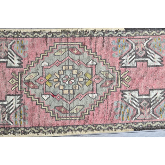 This is a vintage Turkish Oushak rug from the 1960s. The piece was hand-knotted.