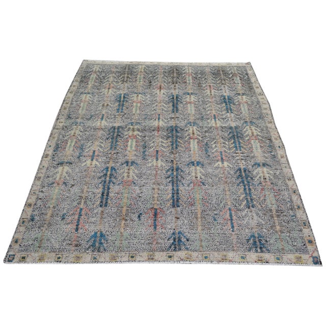 Hand-knotted with care using traditional rug-making techniques, this wool rug blends timeless craftsmanship with a modern...