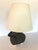 An absolutely adorable table lamp having a handmade sculpture of a wooly sheep and new parchment shade and silk cord.
