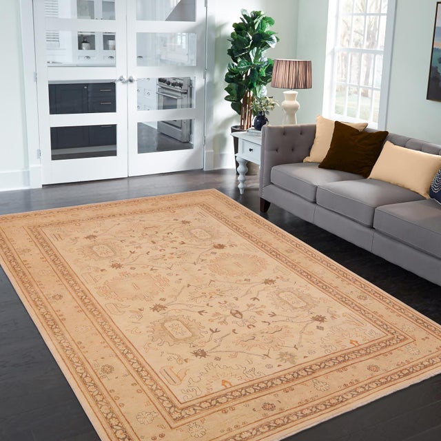 "Enhance the ambiance of your home with this magnificent Persian-influenced Turkish hand-knotted rug made by skilled...