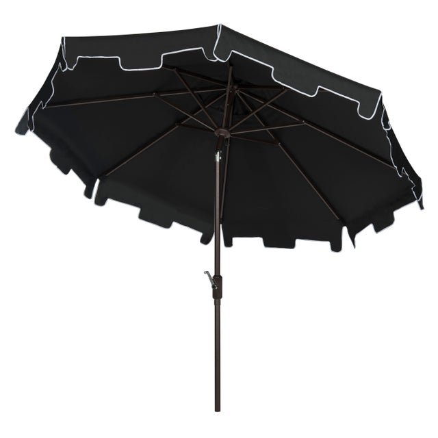 A classic market umbrella gets a chic makeover with fashion-forward black and white fabric and a for extra sun protection...