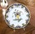 This colorful antique French faience platter features a classic Rouen-style floral decoration with a bold scalloped...