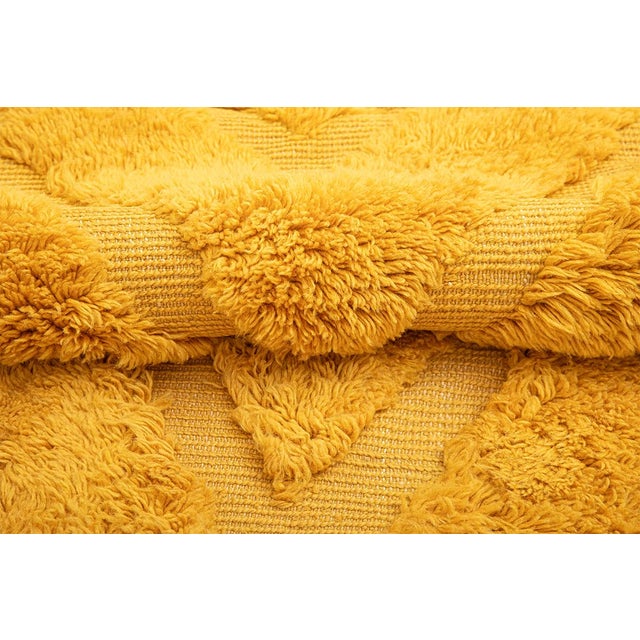 This monumental hand-knotted wool rug by Azele Studio is an exceptional oversized statement piece, designed to transform...