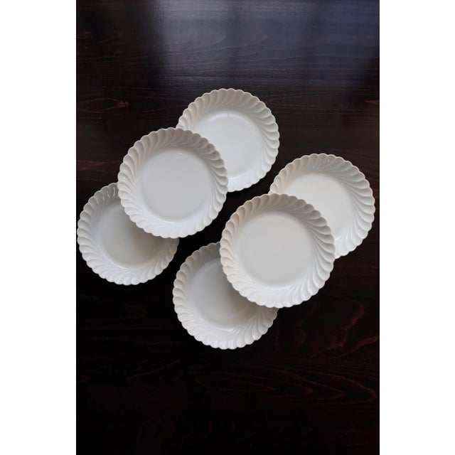 Elegant set of six soup plates in fine white porcelain, signed Haviland Limoges. The twisted rim features a refined...