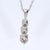 18k White Gold Three-Stone Diamond Pendant on Chain For Sale - Image 4 of 4