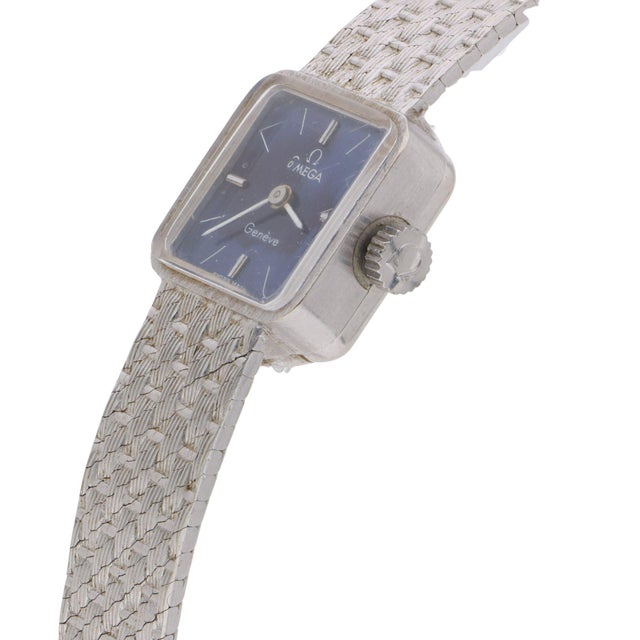 Omega Geneve Vintage Watch 29.23 grams This vintage Omega Geneve ladies watch features a deep navy blue square dial with...