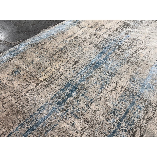 Design Plus Gallery presents the 9ft 4in × 11ft 8in Custom Area Rug from Starck Carpet. The area rug has an abstract,...