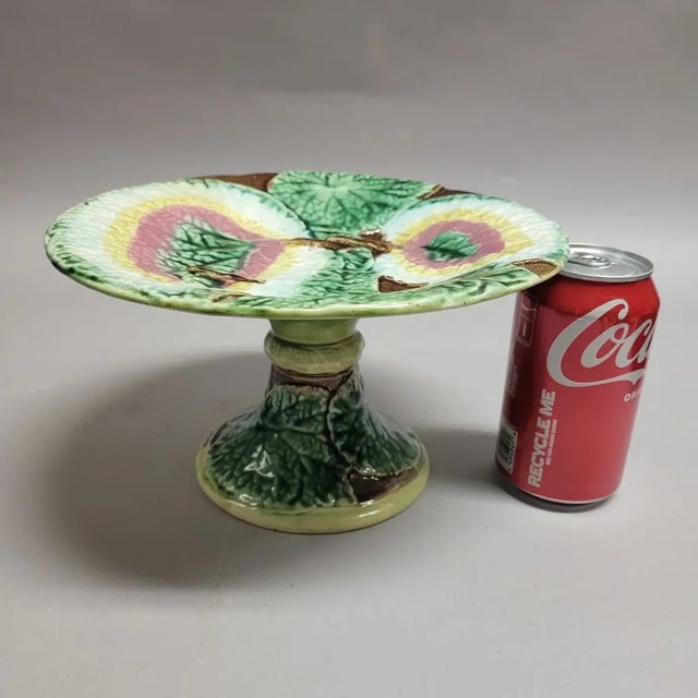 A fine, circa 1870, majolica begonia leaf pattern compote. Green begonia leaves also wrap around the base, a lovely...
