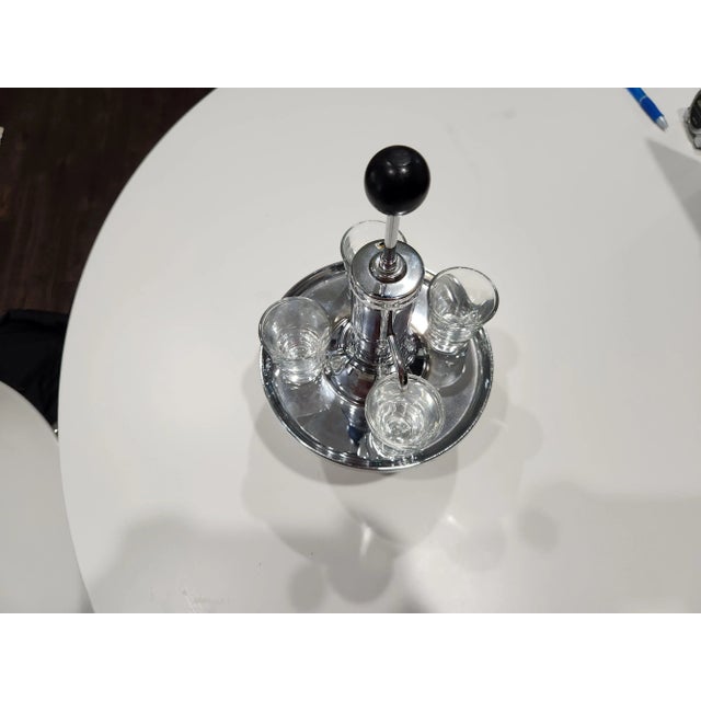 Vintage park Sherman co. pump liquor dispenser and shot glasses. set of 4 glasses and 1 dispenser.